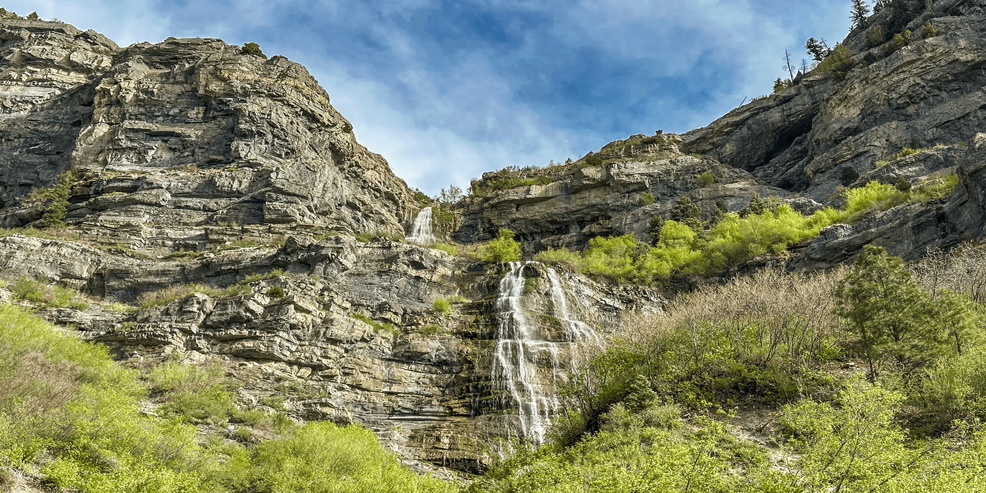 Waterfall cascading down rocky mountain landscape. Waterfall cascading down rocky mountain landscape.